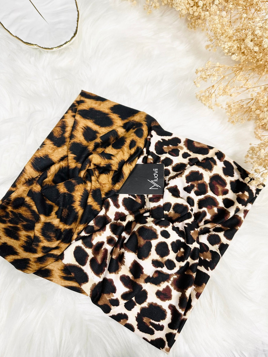 Shop the Animal Print Twist Headband, a lightweight headband with a chic twist design. Perfect for daily wear, this leopard print headband combines style and comfort!